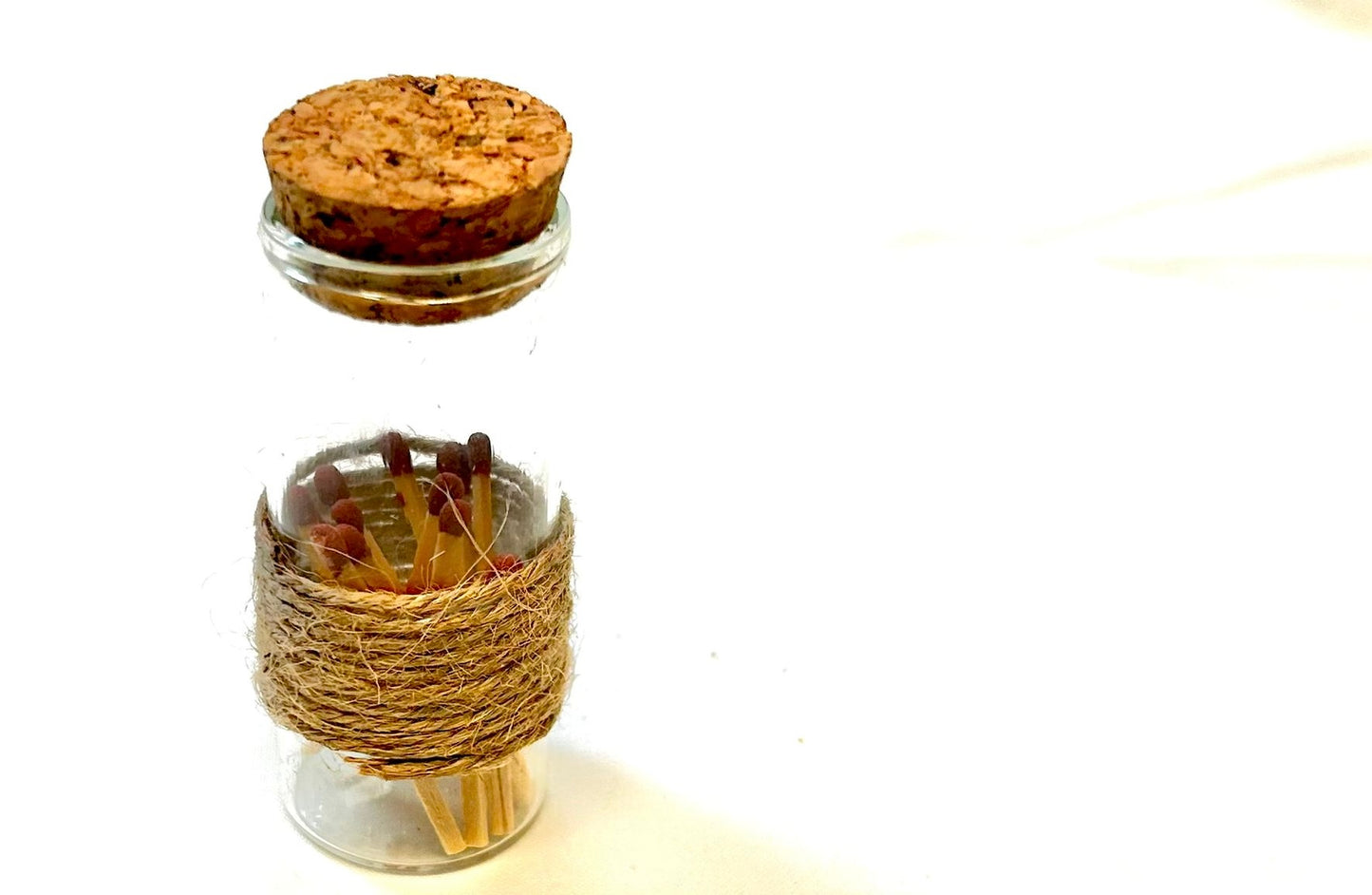 VANILLA Scented coconut shell soy wax candles with wooden slice and bottle of matches.