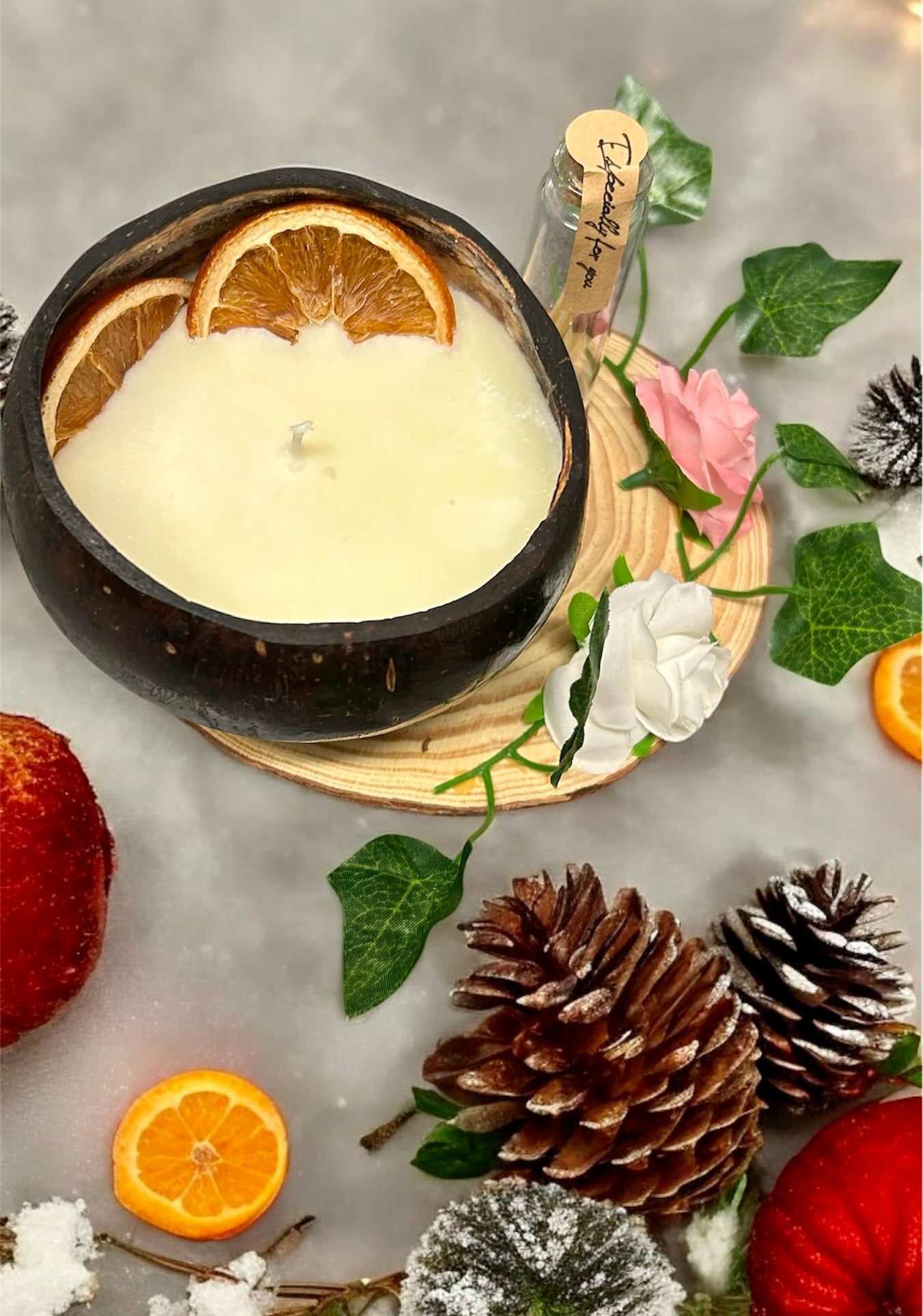 ORANGE Scented Coco shell candle with wooden slice and bottle of
