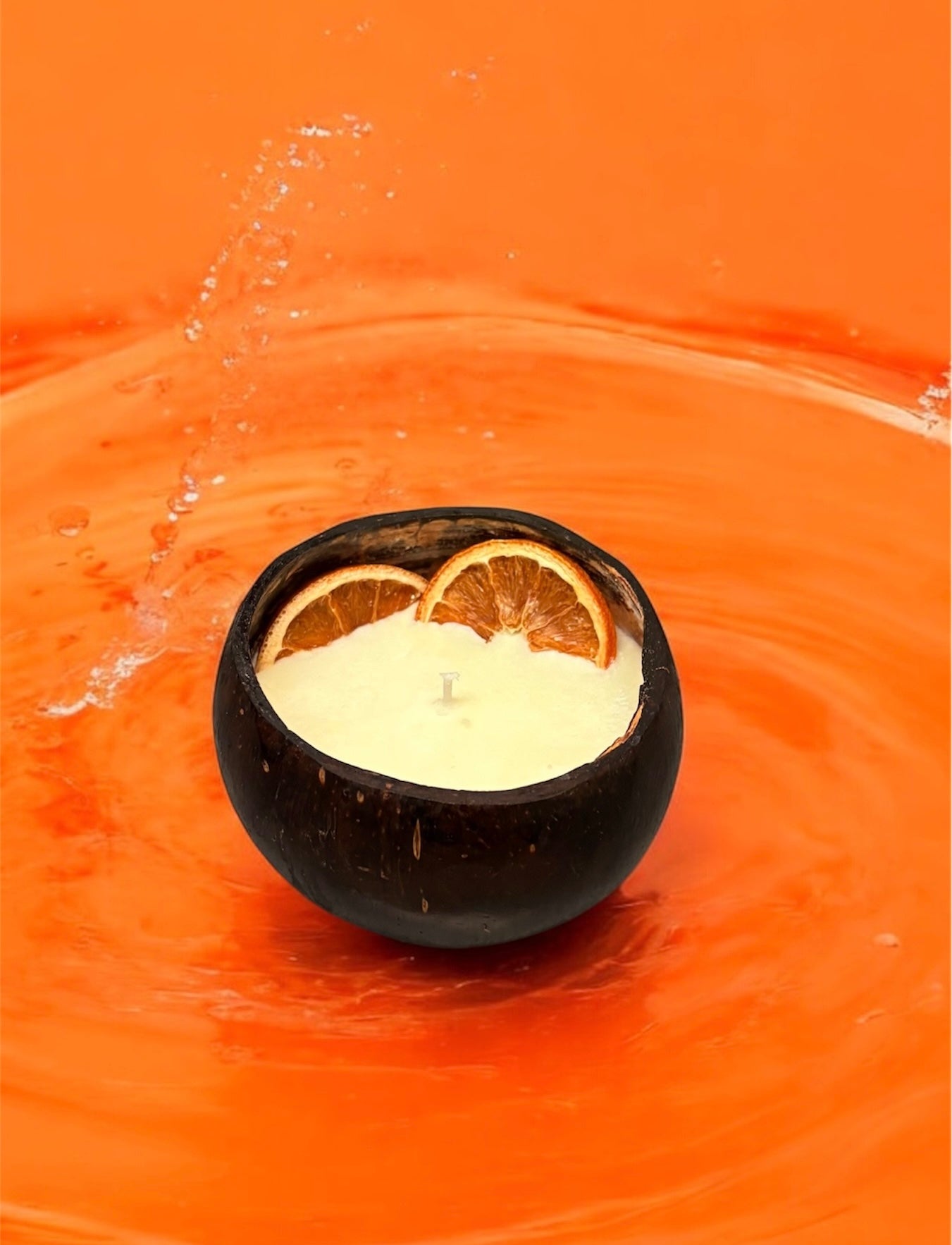 ORANGE Scented Coco shell candle with wooden slice and bottle of
