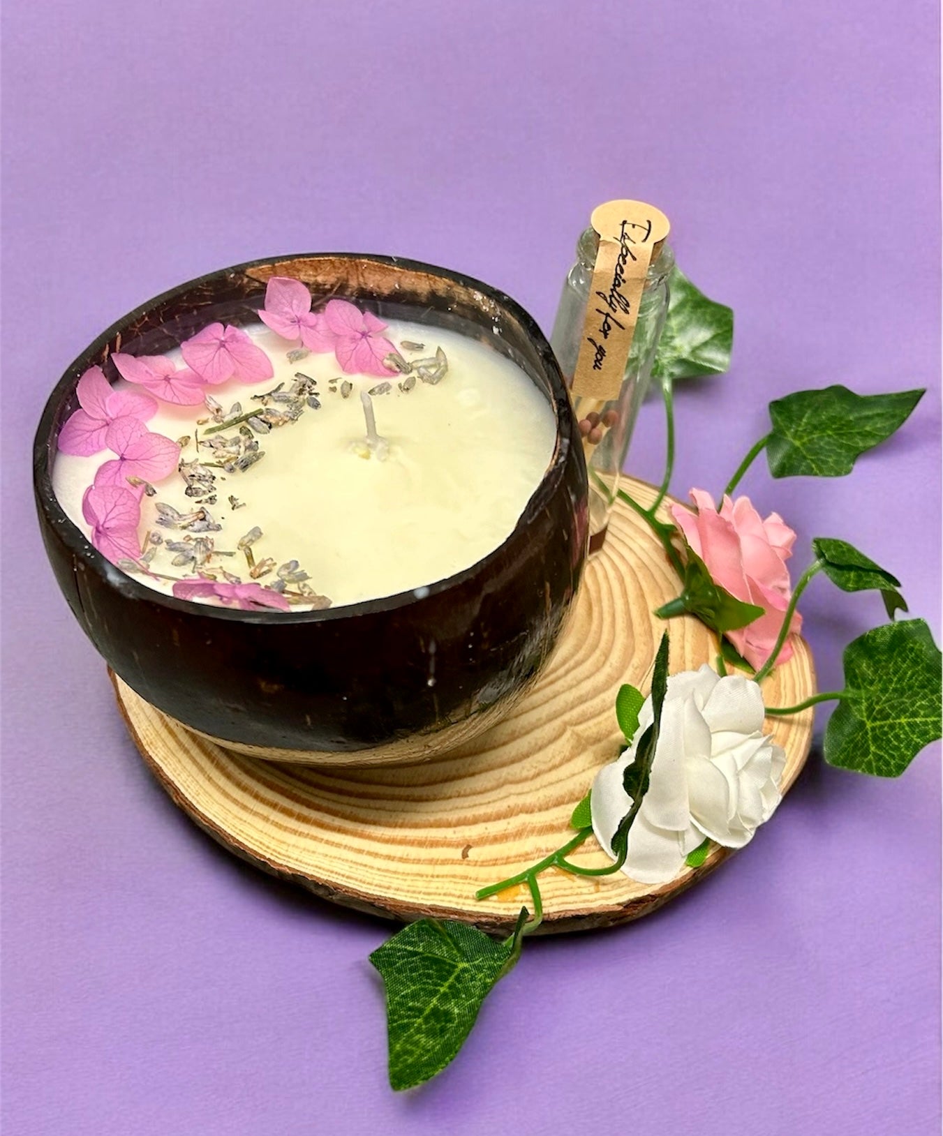 LAVENDER Scented Coco shell candle with wooden slice and bottle of matches.