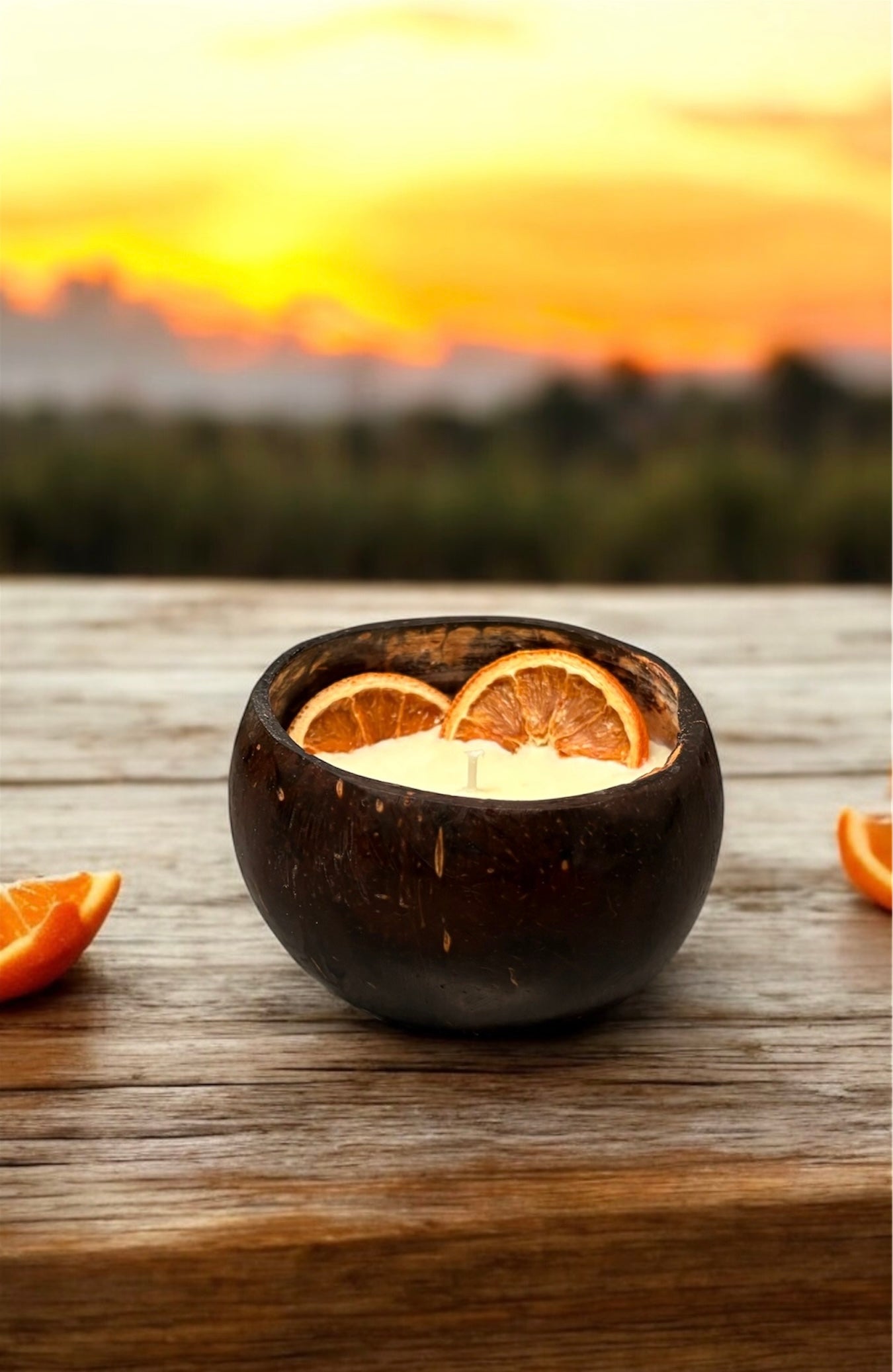 ORANGE Scented Coco shell candle with wooden slice and bottle of matches.